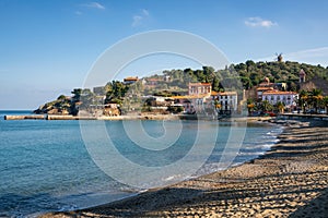 Collioure view from the beach with the Mill on the top of the village