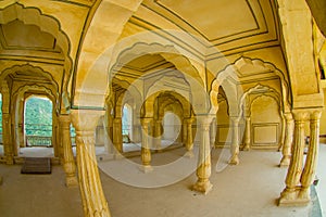 Collumned yellow hall in Sattais Katcheri in Amber Fort near Jaipur, Rajasthan, India. Amber Fort is the main tourist