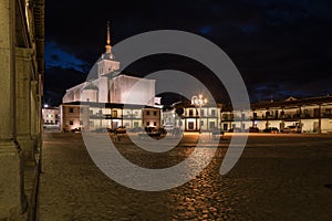 Colmenar de Oreja city landscape with the arcaded square illuminated at night, Spain photo