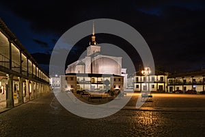 Colmenar de Oreja city landscape with the arcaded square illuminated at night, Spain photo