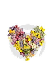 Colofrull Farfalle Italian pasta in shape of heart. Various colors of bow tie farfalle pasta in shape of love sign