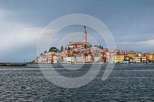 Coloful Rovinj contrasts with the darkening sky