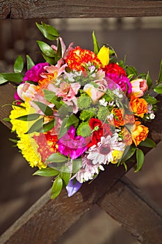 Coloful wedding bouquet on a wooden background