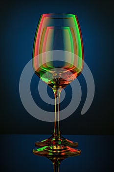 Coloful wineglass on table.