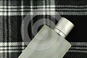 Cologne bottle on check pattern