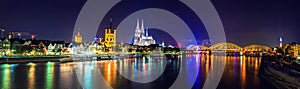 Cologne Cathedral and bridge night scene panorama