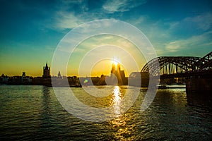 Cologne Cathedral, Catholic Church and Hohenzollern Bridge. Photo for postcard. Holy sunset.