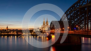 Cologne Cathedral and the Hohenzollern bridge during a sunset
