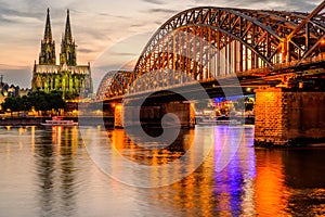 Cologne Cathedral and Hohenzollern Bridge at sunset, Germany