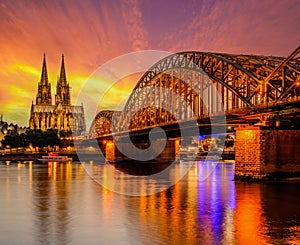 Cologne Cathedral and Hohenzollern Bridge at sunset, Germany