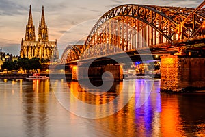 Cologne Cathedral and Hohenzollern Bridge at sunset, Germany