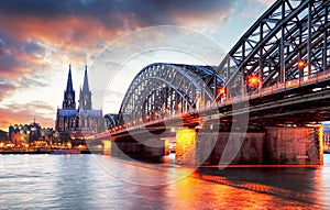 Cologne Cathedral and Hohenzollern Bridge at sunset - night