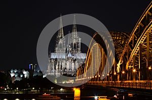 Cologne Cathedral and Hohenzollern Bridge at sunset / nighttime