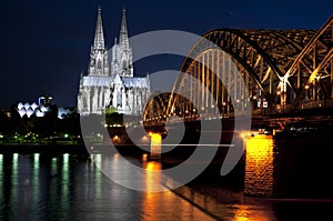 Cologne Cathedral with railway bridge at night