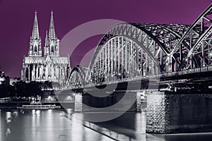 Cologne, Germany. Night view of Cologne Cathedral and Hohenzollern Bridge