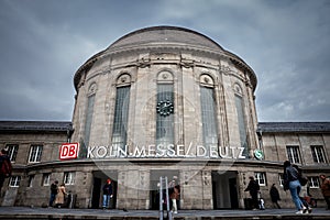 COLOGNE, GERMANY - NOVEMBER 6, 2022: Main building of Koln Messe Deutz Bahnhof train station with passengers passing. It's a