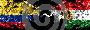 Colombia, Colombian vs Kurdistan, Kurdish, Kurds smoky mystic flags placed side by side. Thick colored silky abstract smokes flags