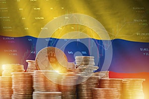 Colombia flag and big amount of golden bitcoin coins and trading platform chart. Crypto currency photo
