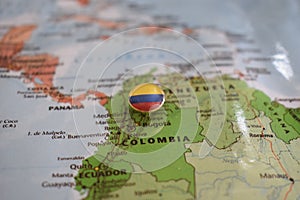 Colombia flag drawing pin on the map