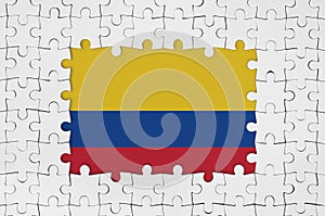 Colombia flag in frame of white puzzle pieces with missing central part photo