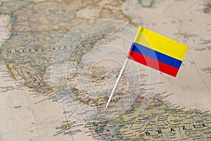 Colombia flag pin on world map
