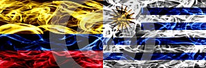 Colombia vs Uruguay, Uruguayan smoke flags placed side by side. Thick colored silky smoke flags of Colombian and Uruguay, Uruguaya photo