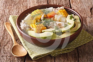 Colombian cuisine: ajiaco soup with chicken and vegetables close