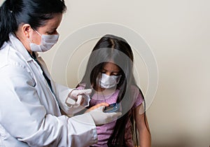 Colombian girl is examined by her pediatrician in the consulting room