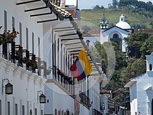 Colombian national flag on white wall exterior facade colonial historic old building architecture Popayan Cauca Colombia