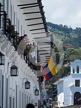 Colombian national flag on white wall exterior facade colonial historic old building architecture Popayan Cauca Colombia