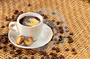 Colombian origin coffee - White cup with delicious coffee and sweet cookies