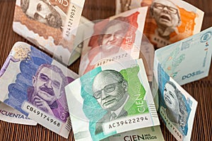 Colombian pesos banknotes, Colombian money scattered on the table, financial concept