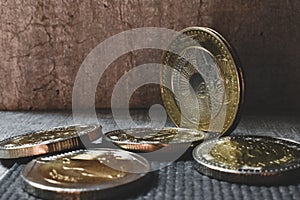 Colombian pesos, bimetallic coins thrown in one corner.