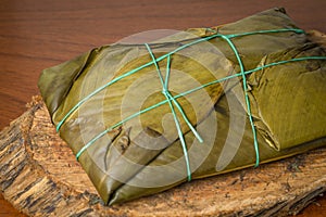 Colombian tamale recipe with steamed banana leaves photo