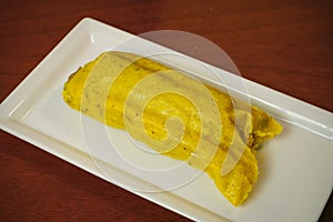 Colombian tamale recipe with steamed banana leaves photo
