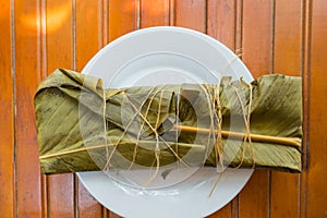 Colombian tamale with steamed banana leaves