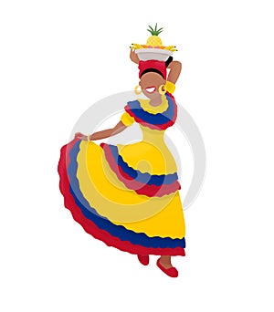 A Colombian woman in flag colored traditional costume dancing happily with the bowl of tropical fruit on her head.