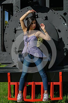 Colombian woman lying on a locomotive before embarking on her trip