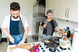 Colombians having fun at home making lunch. Good moments in life as a couple photo