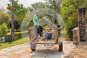 Poor indigenous family in Paraguay with uniaxial carriage and horse.