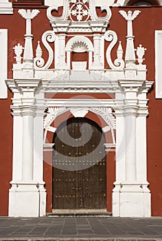 Colonial door and baroque facade