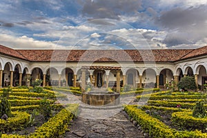 Colonial garden with a well in an old monastery