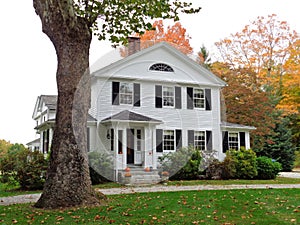 Colonial home in Connecticut with fall colors photo