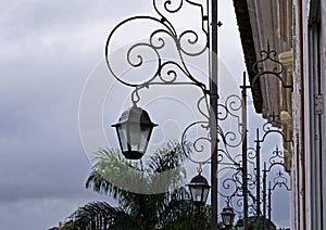 Colonial lanterns and iron volutes in Sao Joao del Rei, Brazil