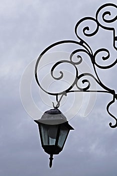 Colonial lanterns and iron volutes in Sao Joao del Rei, Brazil photo