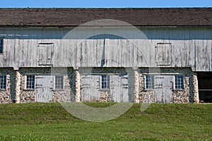 Colonial stone and wood horse stables
