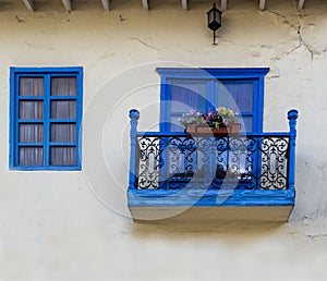 Colonial style blue balcony and window.