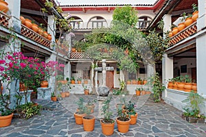 Colonial style patio. Large flower pots