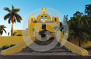 Colonial yellow church with bell tower `Santa Isabel` in Merida , Yucatan, Mexico photo