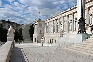 A colonnade decorates the facade of the austrian parliament in Vienna (Austria) photo